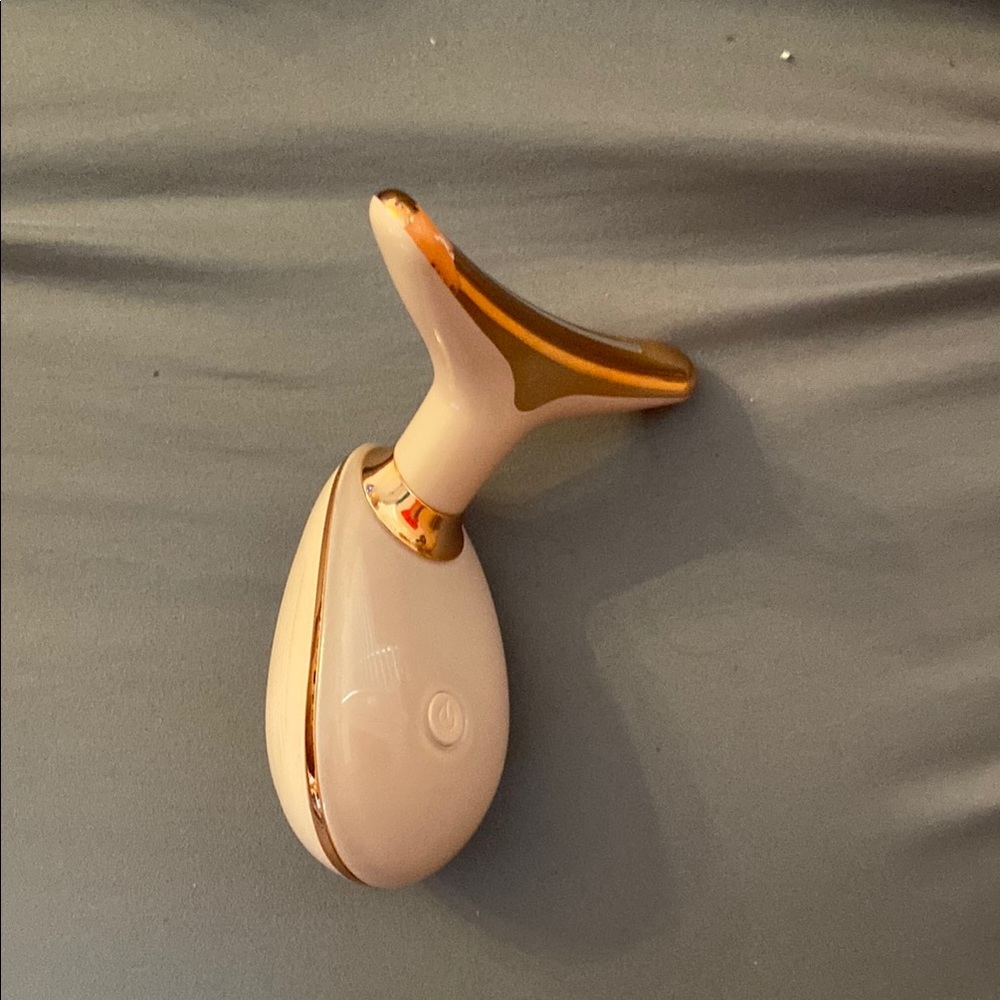 Elegant Skincare Tool in Cream and Gold